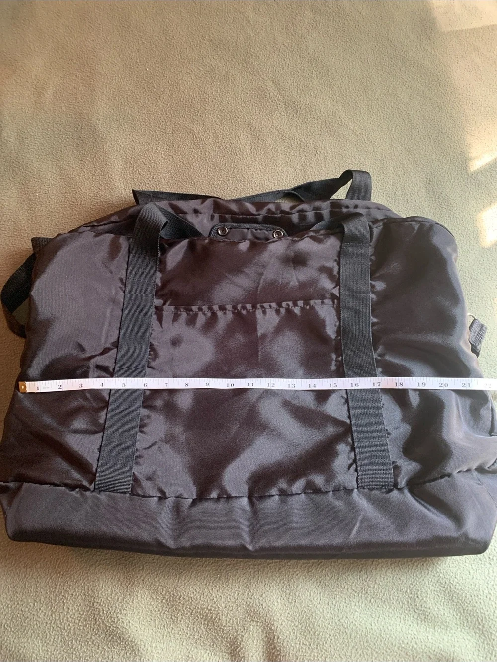 EUC black nylon duffel bag with strap. Approximately 22” x 14” x 10.5”